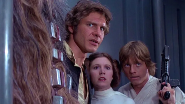 Harrison Ford, Carrie Fisher, Mark Hamill, and Peter Mayhew in 'Star Wars' (1977)