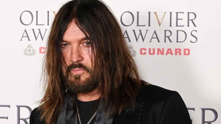 Billy Ray Cyrus poses inside the Winners Room at The Olivier Awards 2026 with Cunard at the Royal Albert Hall.