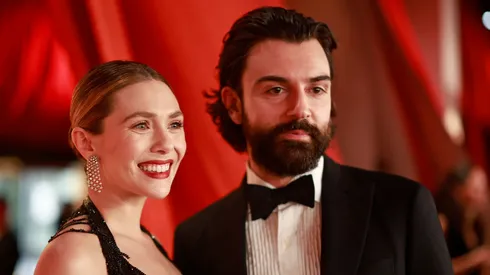 Elizabeth Olsen and Robbie Arnett attend the 95th Annual Academy Awards.
