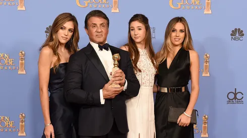 Actor Sylvester Stallone (2nd L), winner of Best Supporting Performance in a Motion Picture for 'Creed,' poses in the press room with daughters Sistine, Sophia and Scarlet during the 73rd Annual Golden Globe Awards held at the Beverly Hilton Hotel on January 10, 2016 in Beverly Hills, California.