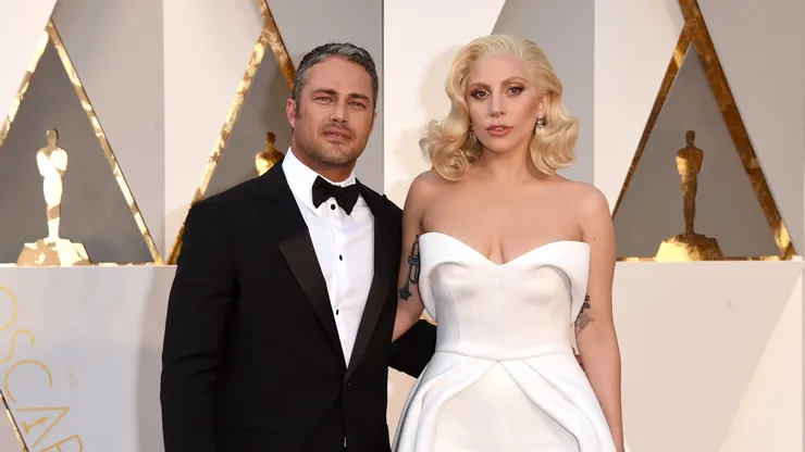 Recording artist Lady Gaga (R) and actor Taylor Kinney attend the 88th Annual Academy Awards at Hollywood & Highland Center on February 28, 2016 in Hollywood, California.