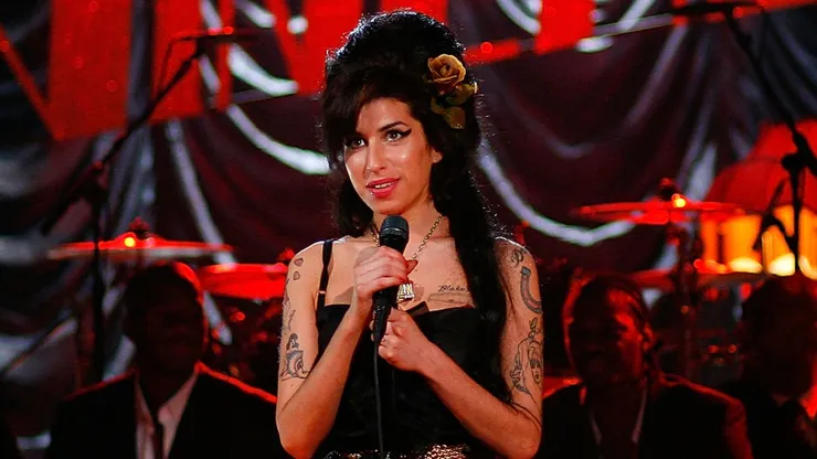 British singer Amy Winehouse performs at the Riverside Studios for the 50th Grammy Awards ceremony via video link on February 10, 2008 in London, England. Winehouse won 5 out of her 6 nominations including, record of the year, best new artist, song of the year, pop vocal album and female pop vocal performance.