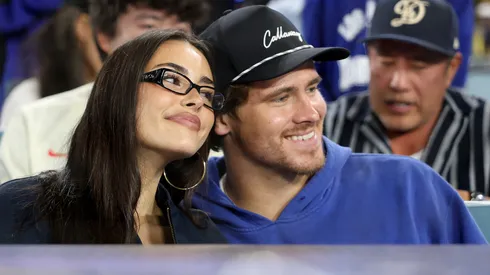 Singer and songwriter Madison Beer and Justin Herbert of the the Los Angeles Chargers watch game three of the 2025 World Series between the Toronto Blue Jays and the Los Angeles Dodgers at Dodger Stadium on October 27, 2025 in Los Angeles, California.